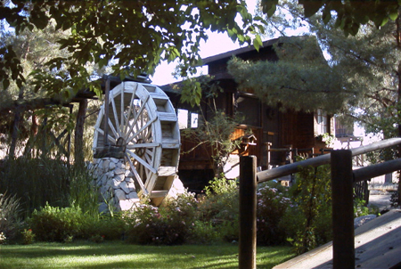 The pond paddlewheel and visitor cottage